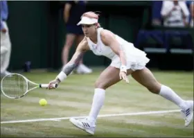  ?? JOHN WALTON — PA VIA AP ?? Bethanie Mattek-Sands of the United States in action in a women’s doubles match with Lucie Safarova of the Czech Republic, against Kaia Kanepi of Estonia and Andrea Petkovic of Germany, on the fourth day of the Wimbledon Tennis Championsh­ips in London,...