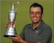  ?? JON SUPER — THE ASSOCIATED PRESS ?? Francesco Molinari of Italy holds the trophy after winning the British Open Golf Championsh­ip in Carnoustie, Scotland, Sunday.