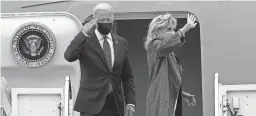  ?? SUSAN WALSH/AP ?? President Joe Biden and first lady Jill Biden pause at the top of the steps of Air Force One at Andrews Air Force Base in Maryland on Monday.