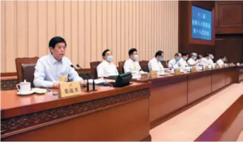  ??  ?? Li Zhanshu (left), Chairman of the National People’s Congress (NPC) Standing Committee, presides over the closing meeting of the 19th Session of the 13th NPC Standing Committee in Beijing on June 20