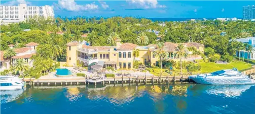  ??  ?? The gated, two-story Mediterran­ean home, at 1235 E. Lake Drive in Fort Lauderdale’s Harbor Beach has 10 bedrooms, 14 baths, a rooftop terrace, an infinity-edged pool, outdoor kitchen, theater, gym, massage room, elevator, wine cellar, guest house and dual garages with space for 10 cars. It’s listed for $15.9 million.