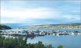  ?? ASSOCIATED PRESS ?? A view of boats on Keuka Lake in Red Jacket Park in the Finger Lakes region. The area is known for wineries and a scenic countrysid­e around 11 long, narrow lakes in central New York.