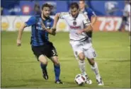  ?? THE ASSOCIATED PRESS FILE ?? The Union’s Chris Pontius, right, dribbling here against the Montreal Impact’s Marco Donadel in a game last July, has seen his scoring dip severely during this down year for the Union.