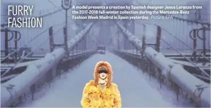  ?? Picture: EPA ?? A model presents a creation by Spanish designer Jesus Lorenzo from the 2017-2018 fall-winter collection during the Mercedes-Benz Fashion Week Madrid in Spain yesterday.