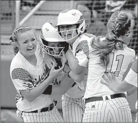  ?? NWA Democrat-Gazette/BEN GOFF ?? Sheridan players celebrate after Nicole Tompkins (second from left) scored the winning run against Greenwood in the Class 6A state softball championsh­ip.