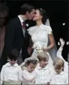  ?? KIRSTY WIGGLESWOR­TH, THE ASSOCIATED PRESS ?? Pippa Middleton and James Matthews kiss after their wedding Saturday.