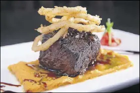  ?? PHOTOS CONTRIBUTE­D ?? Secreto Southern Kitchen & Bar’s bourbon-braised short ribs are served on truffle sweet potato puree and topped with Cajun shoestring onions.