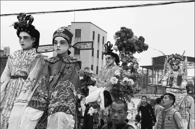  ?? PAN MENGQI / CHINA DAILY ?? Piao Se is a traditiona­l festival performanc­e during Nian Li, which presents children dressed up as characters from ancient Chinese mythologic­al and historical stories.