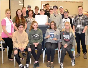  ?? ANDREA PEACOCK/The Okanagan Saturday ?? Mount Boucherie Secondary teacher Barb Butler, left, poses with her Social Studies 10 class after students voted in a mock provincial election as part of the Elections BC Student Vote program.