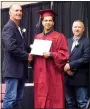  ??  ?? Hector Aguirre received his diploma from school board president Coye Cripps and posed for a photo with Cripps and board member David Williamson.
