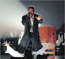 ?? KEVIN WINTER GETTY ?? Kendrick Lamar performs part of his track “King’s Dead, “from the Black Panther soundtrack, during the Grammy Awards on Jan. 28.