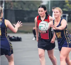  ?? PHOTO: REBECCA RYAN ?? Back on court . . . Valley Karaka WD Lauren Hueppauff passes the ball to WA Mikayla Rowland during a North Otago club netball game in Oamaru on Saturday. Also pictured is Waitaki Girls' defender Allie Senior.