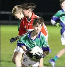  ??  ?? Tom Deavy of Glynn dodges the challenge of Gorey’s Kian Keogh.