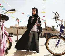  ??  ?? Mansour was the first woman to shoot a film in Saudi Arabia in 2012. The film, Wadjda, is about a girl who dreams of riding her own bike.