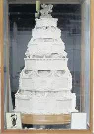  ??  ?? Slice of history Replica of the wedding cake before it was vandalised by squatters