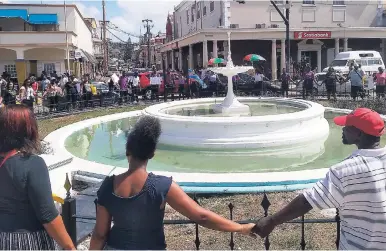  ?? PHOTOS BY OKOYE HENRY ?? Citizens of Montego Bay created a human chain around the iconic fountain in Sam Sharpe Square in solidarity with families who have lost their loved ones to crime.