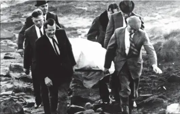  ??  ?? Search: Police in 1965 on the moors with the body of one of Brady’s victims