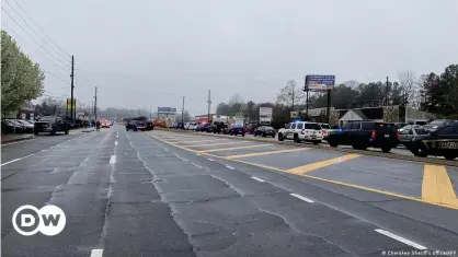  ??  ?? The Cherokee Sheriff’s Office released this image of law enforcemen­t cars blocking the area of a shooting in the Atlanta area