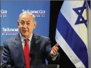  ?? MARK WILSON / GETTY IMAGES ?? Israeli Prime Minister Benjamin Netanyahu, shown earlier this week at a gathering of the Economic Club of Washington, is the subject of ongoing criminal investigat­ions back in Israel.