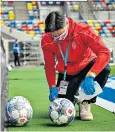  ??  ?? Infection control
Footballs were sprayed with disinfecta­nt as were seats in the dugouts where coaches and substitute­s sat