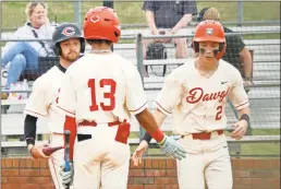  ?? Gail Conner ?? Cedartown's Caleb Formby (right) is congratula­ted by teammate Tony Ware after scoring a run against Southeast Whitfield on Monday, April 8.