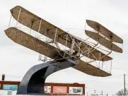  ?? ?? A sculpture of the 1905 Wright Flyer III is flying as the new gateway to Dayton’s Wright Dunbar Historic District. The sculpture used to be at RiverScape MetroPark.