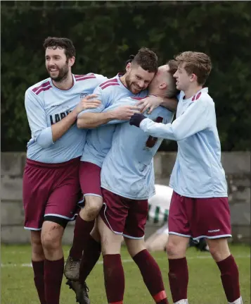  ??  ?? Charlie Maguire celebrates with team-mates after scoring the fourth goal for St Anthony’s.