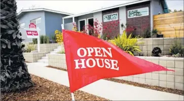  ?? Jay L. Clendenin Los Angeles Times ?? THE MEDIAN PRICE for new and resale homes in Southern California hit $460,000 last month, up $5,000 from January, according to real estate firm CoreLogic. Above, an open house in Manhattan Beach in 2015.