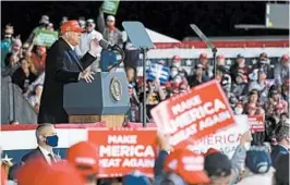  ?? ALEX BRANDON/AP ?? President Trump campaignsW­ednesday night at a rally at the Des Moines Internatio­nal Airport in Iowa. Earlier, Joe Biden in remarks hit at Trump’s handling of the pandemic.