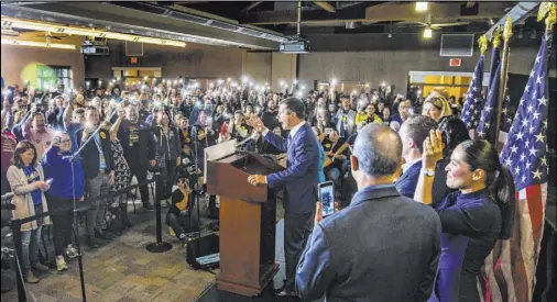  ?? L.E. Baskow Las Vegas Review-Journal @Left_Eye_Images ?? Crowd members provide light with their phones for presidenti­al candidate Pete Buttigieg at Springs Preserve on Saturday.