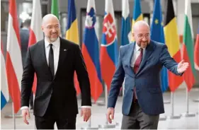  ?? ?? European Council President Charles Michel (right) welcomes Ukraine’s Prime Minister Denys Shmyhal before their bilateral meeting at the EU headquarte­rs in Brussels yesterday. PHOTO: JOHN THYS/AFP