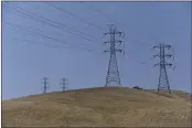  ?? JOEL ROSENBAUM —THE REPORTER ?? Pacific Gas & Electric power lines run up a hillside above Gibson Canyon Road in rural Vacaville.