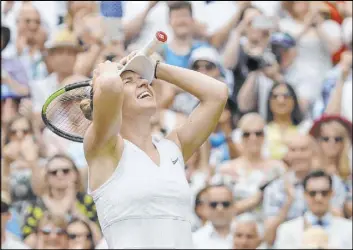  ?? Kirsty Wiggleswor­th The Associated Press ?? Simona Halep celebrates after defeating Serena Williams 6-2, 6-2 in the Wimbledon final Saturday in London to claim the second major title of her career.