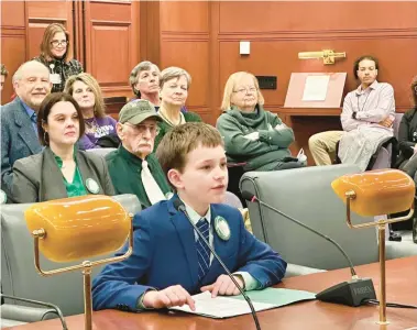  ?? MARK PAZNIOKAS/CT MIRROR ?? William Schloat told lawmakers,“if I had a time machine, I would travel back to Hartford in the 1600s to help the people who are being accused of witchcraft.”two rows behind him at right is Rep. Jane Garibay, sponsor of the exoneratio­n resolution.