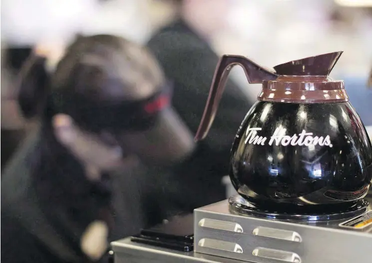  ?? CHRIS YOUNG/THE CANADIAN PRESS FILES ?? The Tim Hortons Canadian Franchisee Advisory Board broke its public silence and assailed the Great White North Franchisee Associatio­n, the dissent group that has waged a war with its parent firm RBI about its practices. RBI has seen recent declines in...