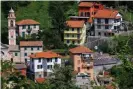  ?? Images ?? The peleton passes through the village of Boasi, near Genoa. Photograph: Luca Bettini/AFP/Getty