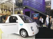  ?? Paul Chinn / The Chronicle ?? Visitors check out a Waymo self-driving car displayed at the Computer History Museum in Mountain View in July.