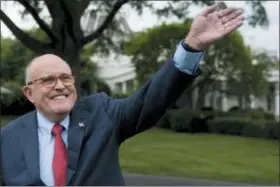  ?? ANDREW HARNIK — THE ASSOCIATED PRESS FILE ?? On May 29, Rudy Giuliani, an attorney for President Donald Trump, waves to people during White House Sports and Fitness Day on the South Lawn of the White House in Washington.