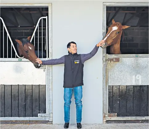  ??  ?? Winner by a nose: Silvestre de Sousa at his stables in Newmarket, with two-year-old Bridget (right) and Dexter