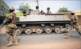  ?? Associated Press ?? NIGERIAN TROOPS patrol this week in the northeaste­rn city of Mubi near the Cameroon border. Troops retook the city from Boko Haram militants in February.