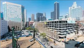  ?? Marcus Yam
Los Angeles Times ?? THE HIGH COURT said municipali­ties have “broad discretion to regulate the use of real property.” Above, a complex goes up in February in downtown L.A.