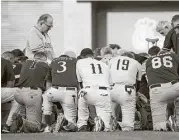  ?? Bill Clark / CQ Roll Call / Newscom ?? Patrick Conroy, chaplain of the House of Representa­tives, left, leads a moment of prayer before the start of the Congressio­nal Baseball Game on Thursday in Washington, D.C.
