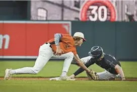  ?? ?? Arundel’s Jake Long, right, steals second base for the North team before the South team’s Josh Sherwood can apply the tag in the fifth inning.