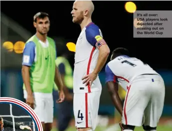  ??  ?? It’s all over: USA players look dejected after missing out on the World Cup