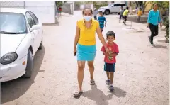  ??  ?? Leti Baires Ventura of El Salvador walks with her son at the Pan de Vida migrant shelter on the outskirts of Ciudad Juárez on Thursday. The two were among more than 101,800 people expelled upon arrival in the U.S. in March under a provision in a public health code known as Title 42.