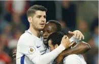  ?? — Reuters ?? Chelsea’s Victor Moses celebrates scoring their second goal with Pedro and Alvaro Morata.