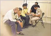  ??  ?? Police talk to the family members of the AAP volunteer who committed suicide on Tuesday. RAJ K RAJ/HT PHOTO