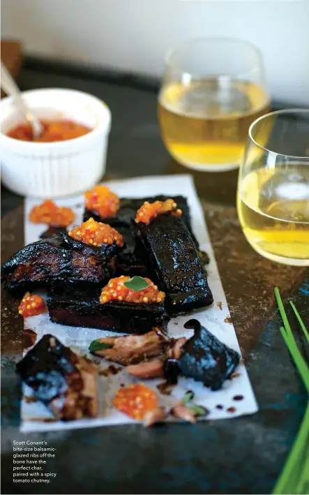 ??  ?? Scott Conant’s bite-size balsamicgl­azed ribs off the bone have the perfect char, paired with a spicy tomato chutney.