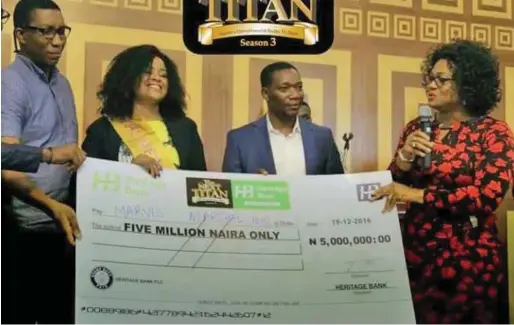  ??  ?? The Next Titan Season 3 winner Marvis Marshal Idio (2nd left), during the presentati­on of the N5 million cheque to her in 2016, in Lagos