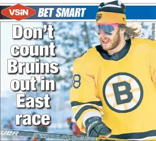  ??  ?? WAITING IN THE WEEDS: David Pastrnak gets ready for the Bruins’ outdoor game in Lake Tahoe last month. Boston sits in fourth place in the East, but with eight games remaining against the NHL-worst Sabres, the Bruins are still a good bet at as high as 3/1 to catch the first-place Islanders and win the division.